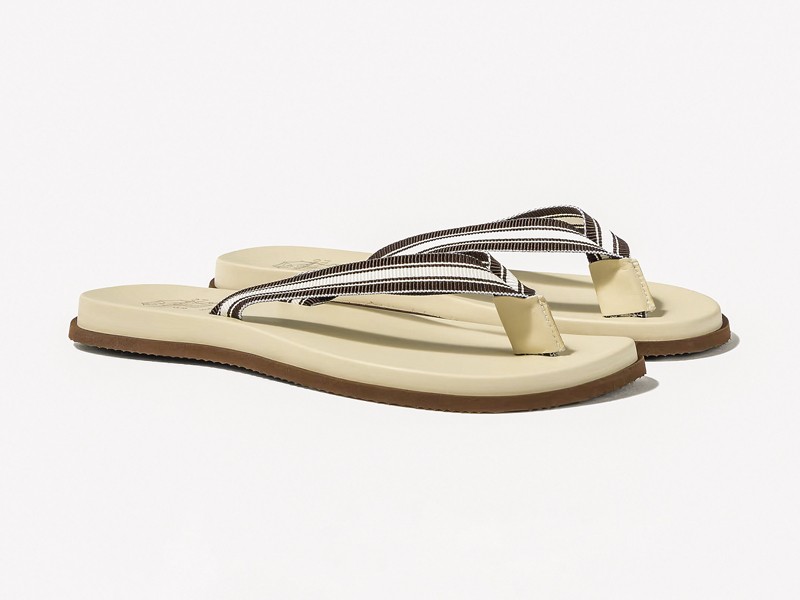 P01187294.jpg Men’s flip-flops highlight profiled soles beneath minimal straps
