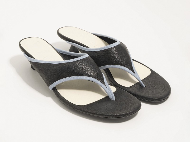 High flip-flops elevate minimal straps with precise heels