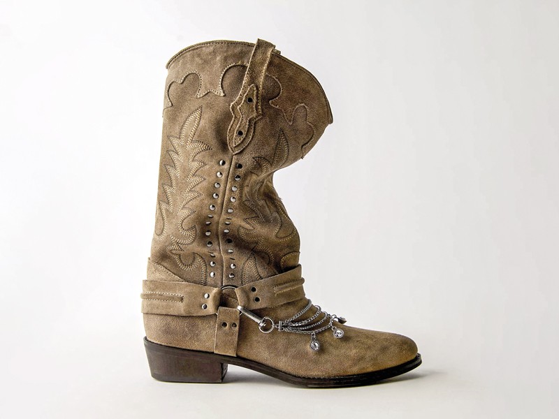 Cowboy boots with tall shafts and pointed toes