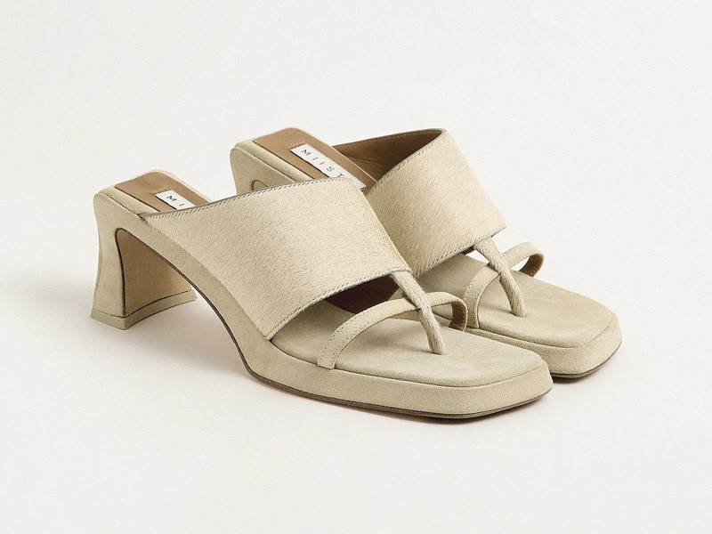 High flip-flops elevate minimal straps with precise heels