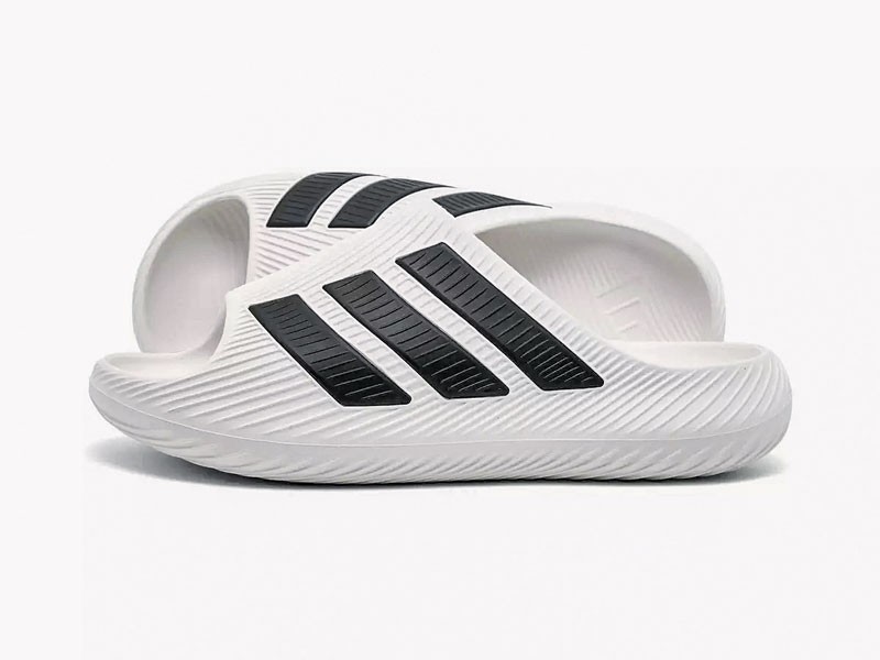 CHANCLAS CONFORT CALZADO HOMBRE TENDENCIA PRIMAVERA VERNAO 2026 2027 SERMA167KI0054_100_P1-(1).jpg Comfort slides emphasize wide straps and substantial soles
