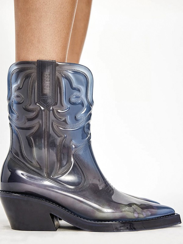 Cowboy boots with tall shafts and pointed toes