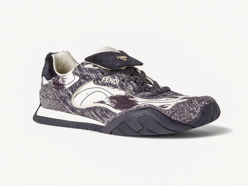 Olive-toned urban sneakers with suede cues and gum sole units