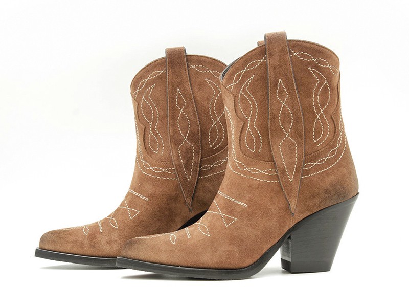 Cowboy boots with tall shafts and pointed toes