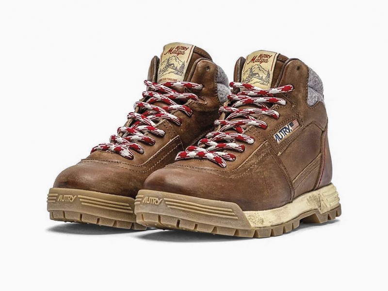 Workwear boots with track soles and visible stitching