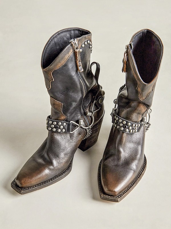 Cowboy boots with tall shafts and pointed toes