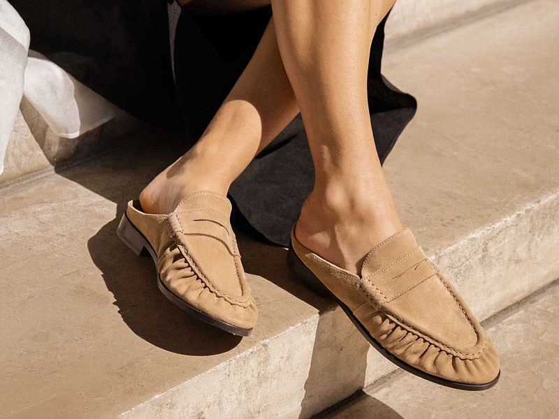 What is the origin of the gathered seam in moccasins?