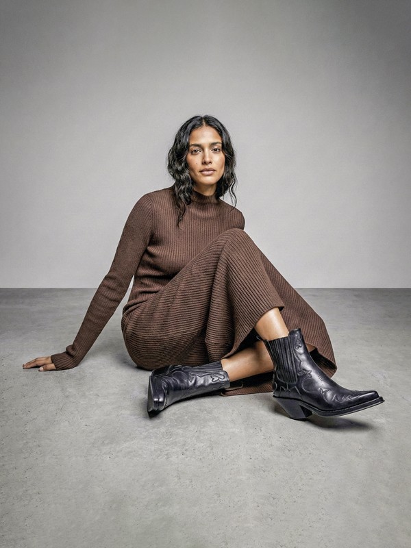 Cowboy boots with tall shafts and pointed toes