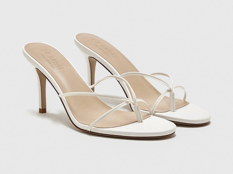 High flip-flops elevate minimal straps with precise heels