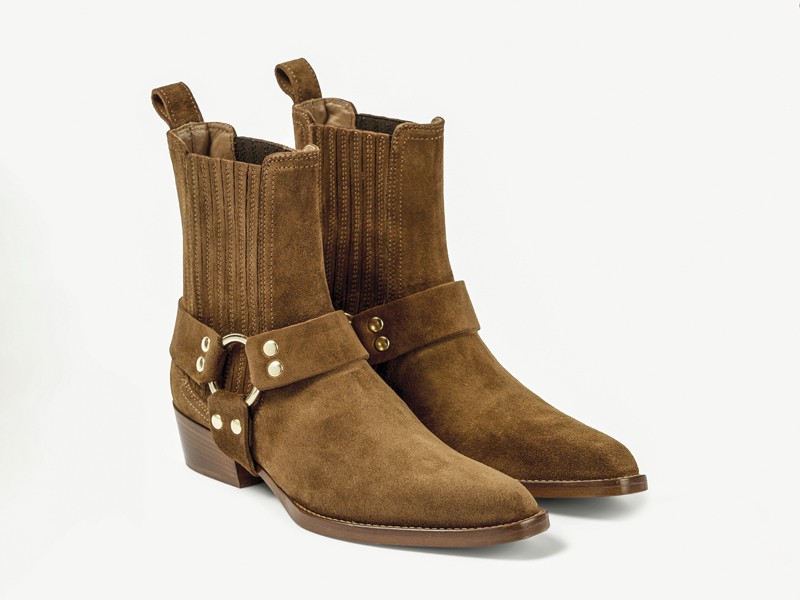 Cowboy boots with tall shafts and pointed toes