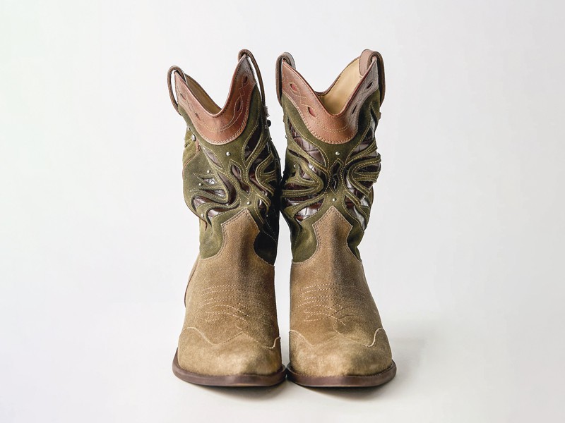 Cowboy boots with tall shafts and pointed toes