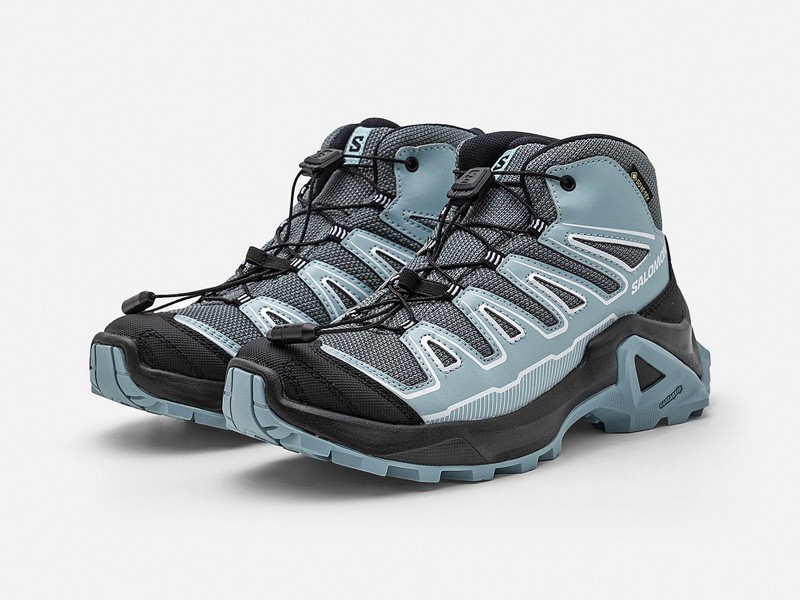 Kids outdoor footwear with traction soles and protective reinforcements