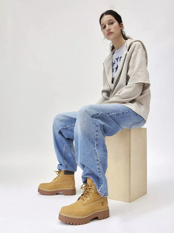 Workwear boots with track soles and visible stitching