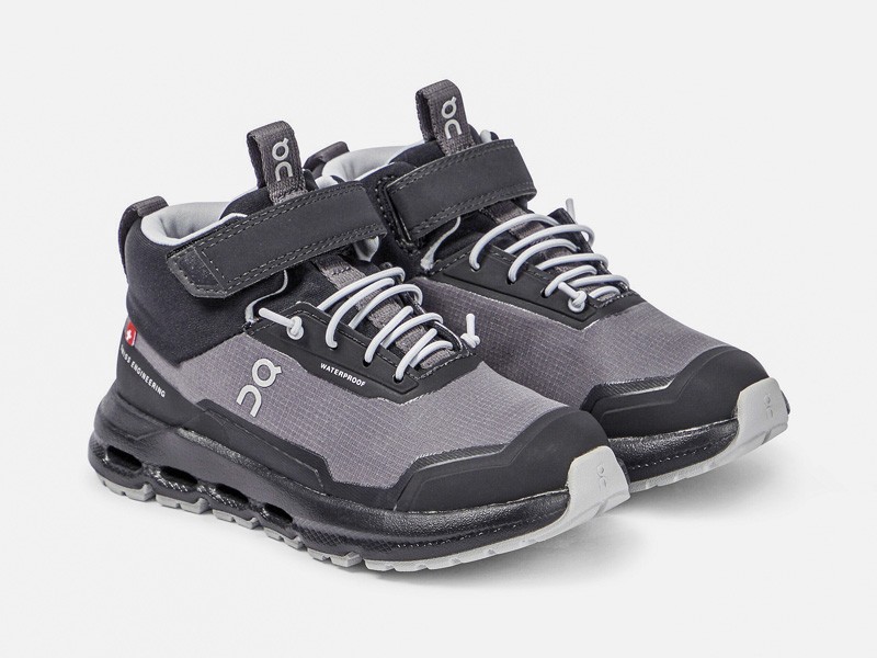 Kids outdoor footwear with traction soles and protective reinforcements