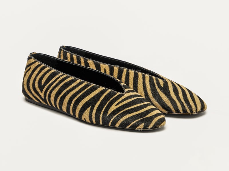 Animal-print ballerinas focus on surface and contrast
