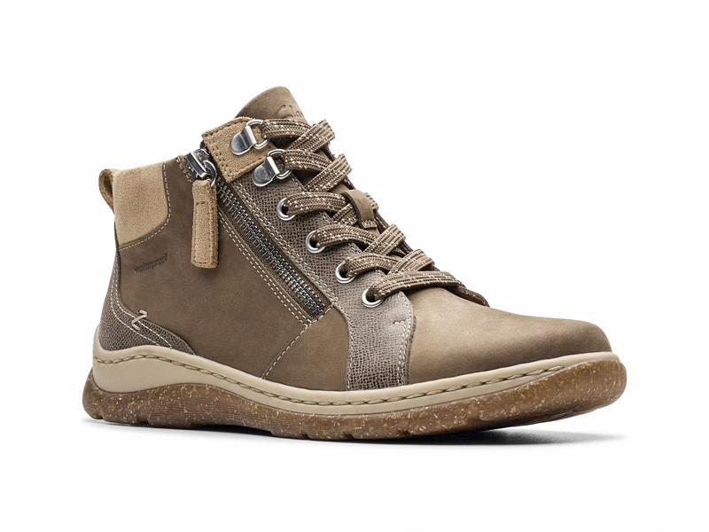 Workwear boots with track soles and visible stitching