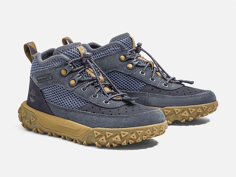 Kids outdoor footwear with traction soles and protective reinforcements