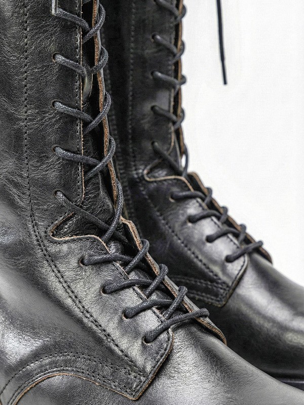 Laced boots with high lacing and utility profiles