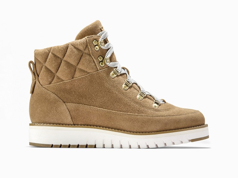 Workwear boots with track soles and visible stitching