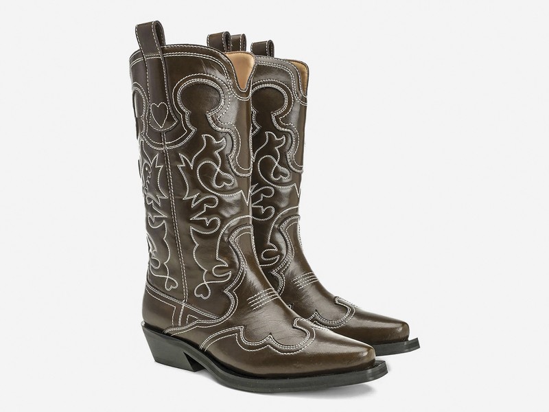 Cowboy boots with tall shafts and pointed toes