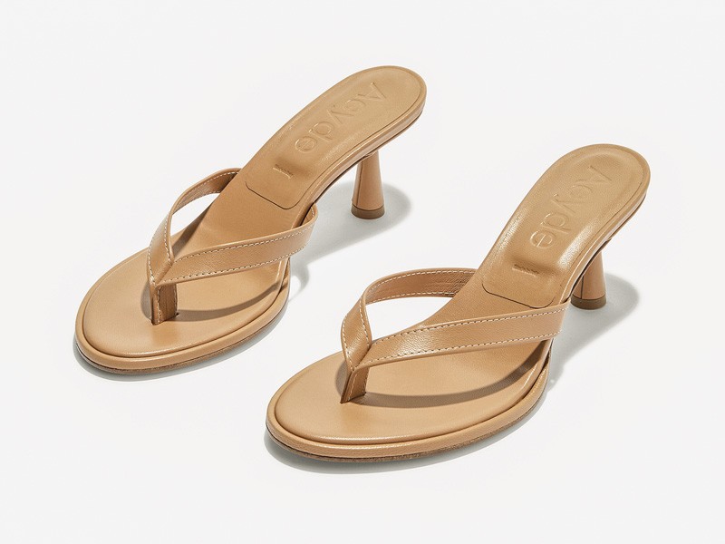 High flip-flops elevate minimal straps with precise heels