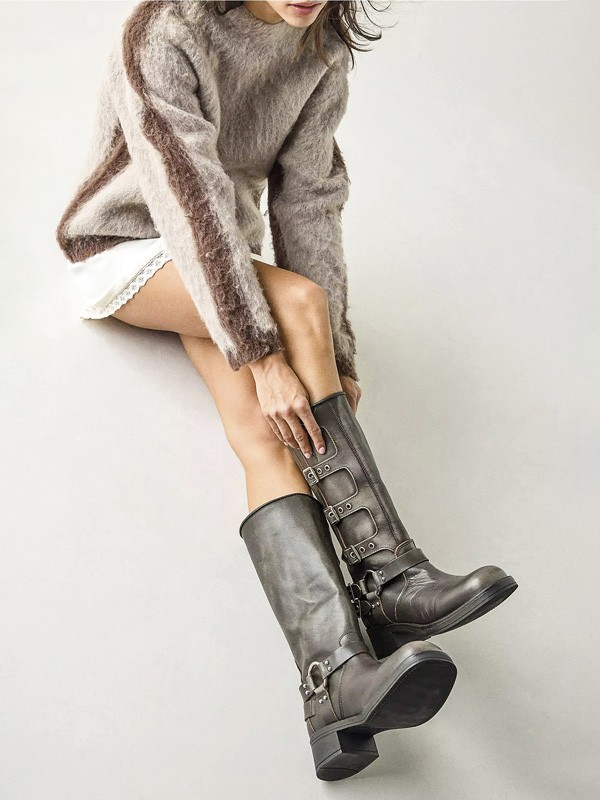 Biker boots with straps, buckles and track outsoles