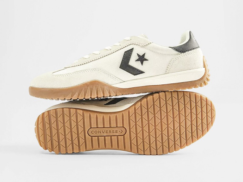 Olive-toned urban sneakers with suede cues and gum sole units