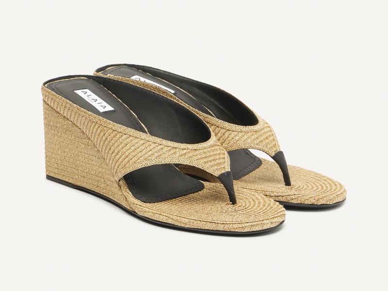 High flip-flops elevate minimal straps with precise heels