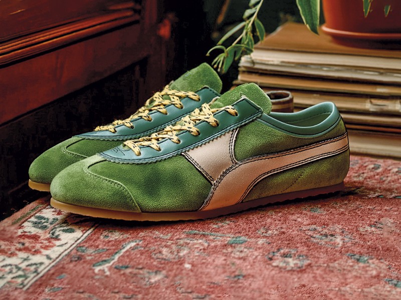 Olive-toned urban sneakers with suede cues and gum sole units